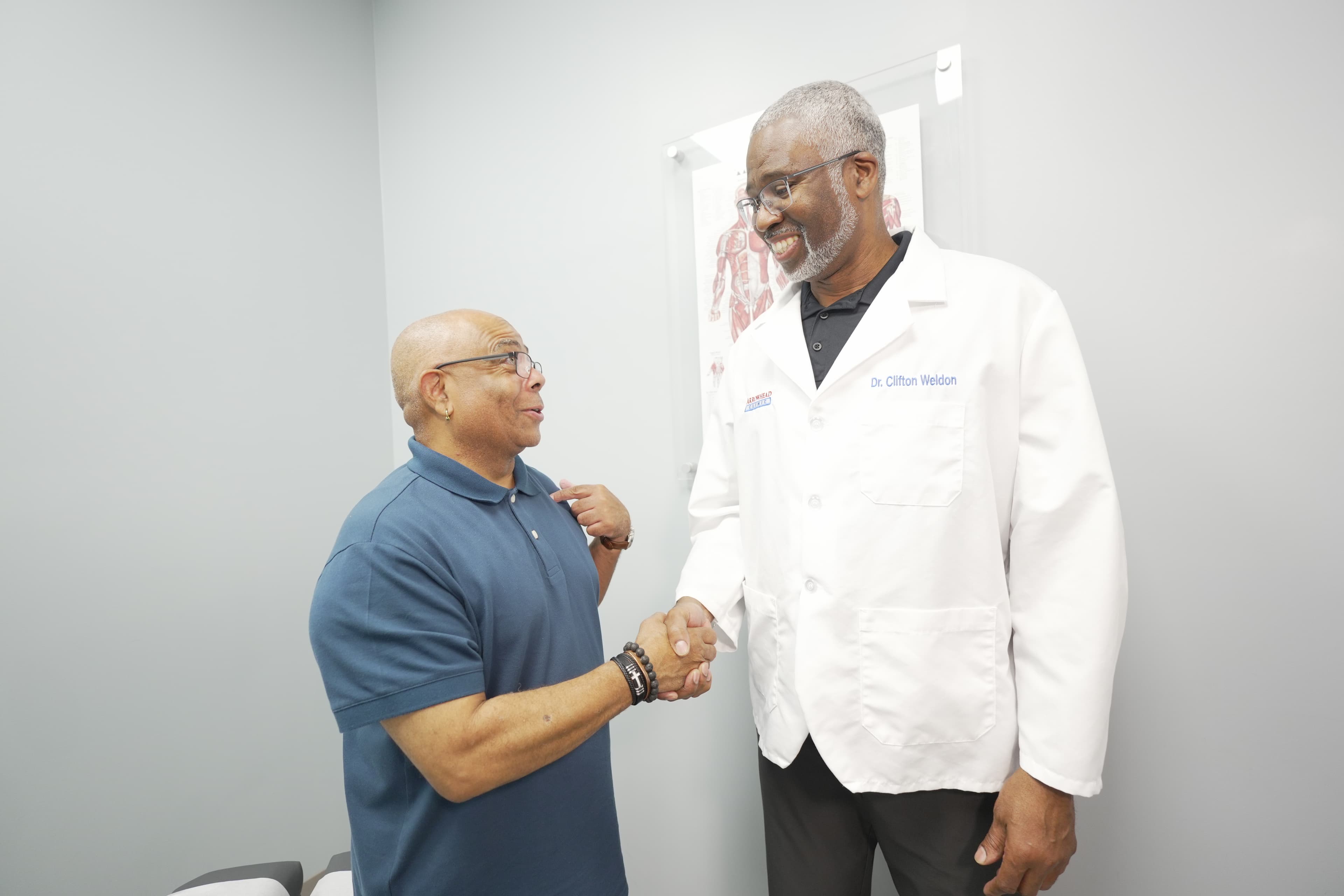 Doctor and patient handshake in clinic
